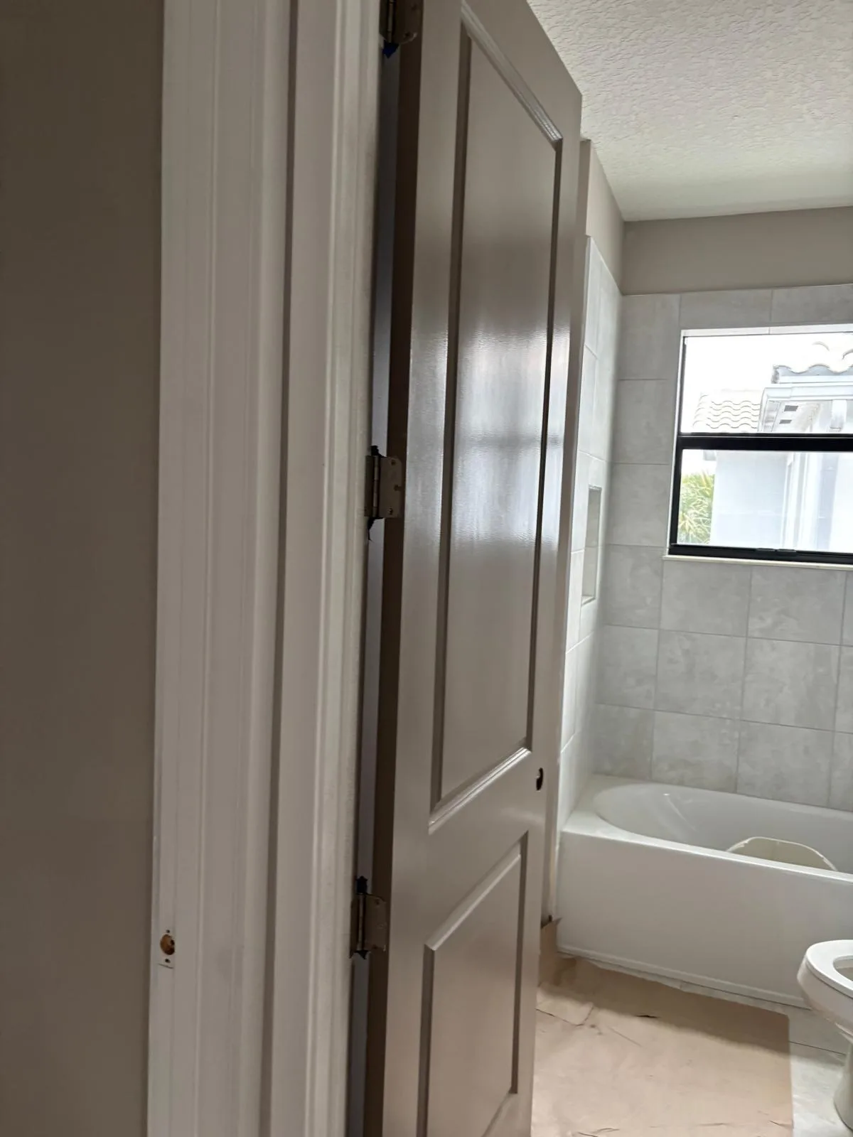 Bathroom Painting Grey Door Tub Parkland by JC General Painting in South Florida