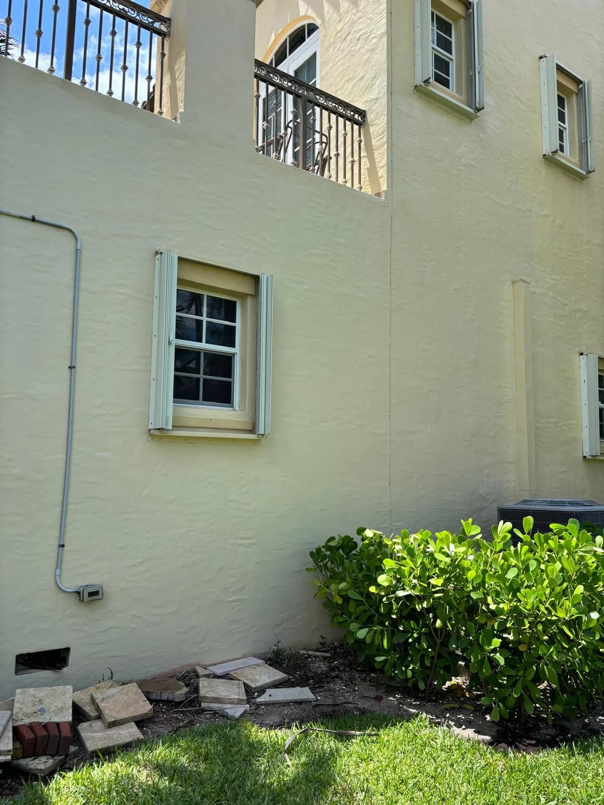 Exterior Stucco Painting Side Wall Window by JC General Painting in South Florida
