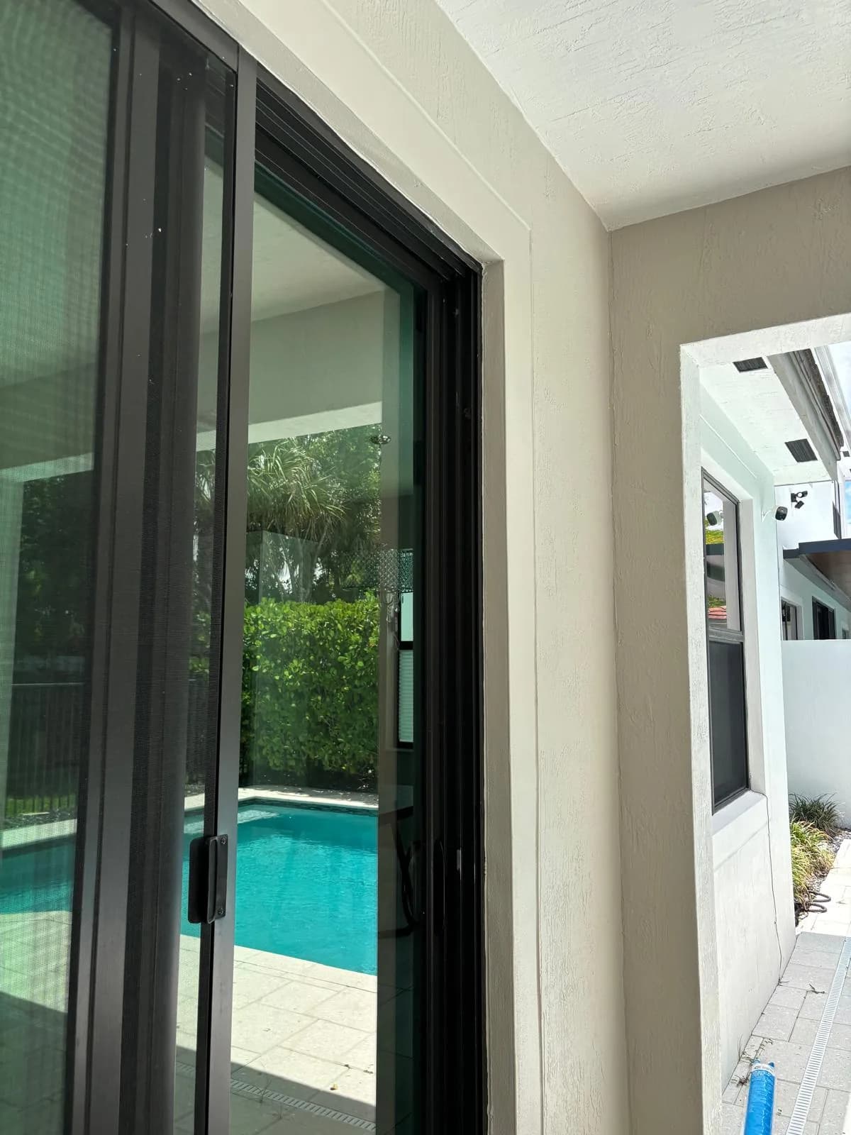Interior Painting Sliding Door Pool View by JC General Painting in South Florida