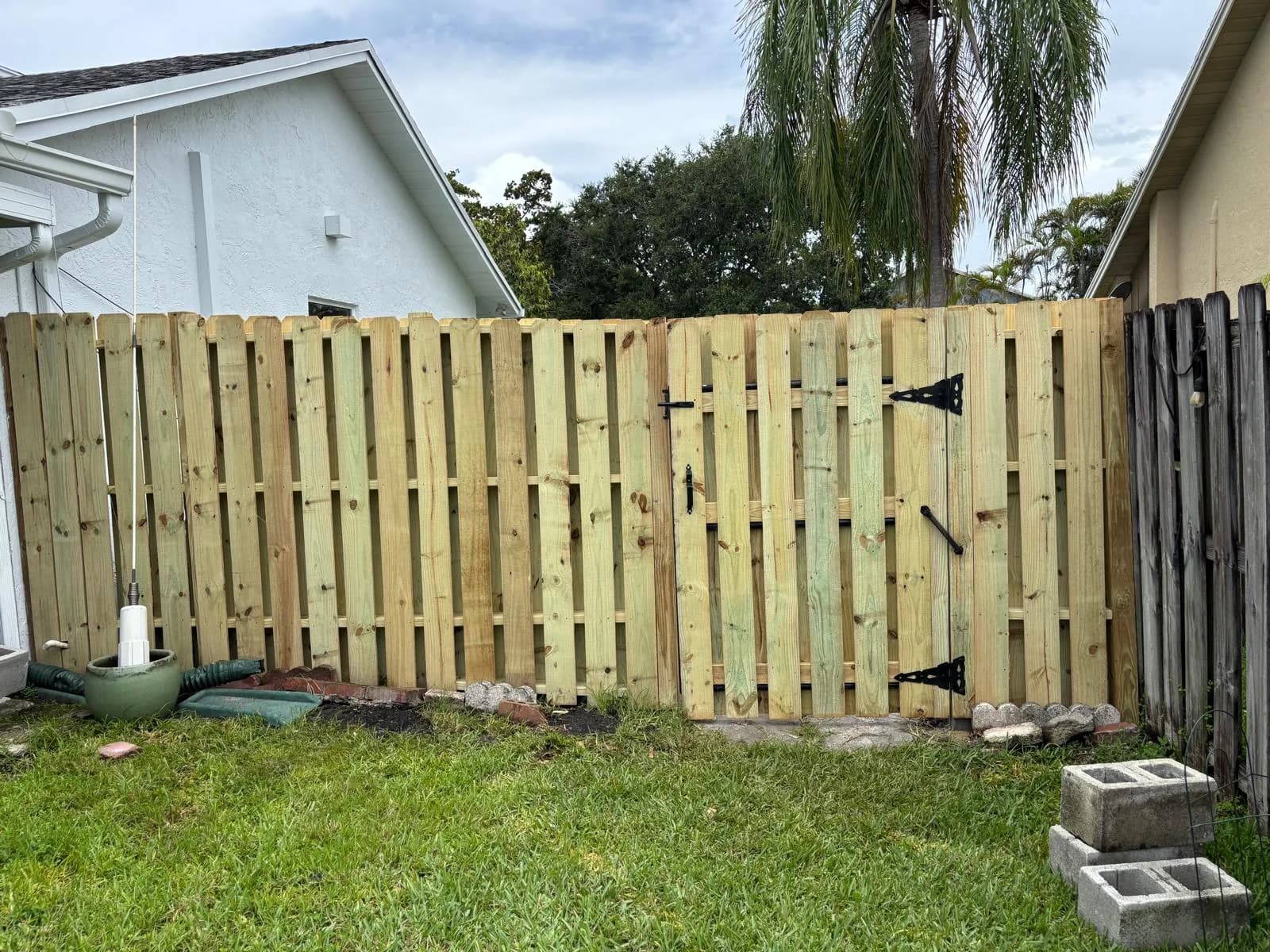 Wood Fence Installation Shadowbox Fence by JC General Painting in South Florida